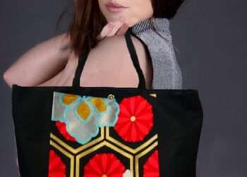 While the kimono is a wardrobe staple for anyone with Japanese heritage, it’s quickly gained popularity worldwide. As people have discovered, with one article of clothing, you can easily add a touch of elegance and class to any outfit. Beyond that, kimonos come in many beautiful patterns and a hue of eye-catching colors. What makes this item of clothing even more unique is the fact that it is handcrafted, so no two kimonos are exactly alike. In other words, you can find a kimono that’s as unique as your personality and be confident that you have a one-of-a-kind product. This makes the kimono the perfect article of clothing for both women and men who pride themselves in owning unique clothes and accessories. While kimonos are more popular among women, they are actually designed to be unisex, and the designs feature some more subtle colors chosen specifically for men. kimonos that are designed for men are much more subdued – in both color and fashion – than those designed for women. A man’s kimono is typically wrapped around the waist, below the stomach and then tied with a simple knot in the back. On the other hand, a woman’s kimono is long, flowing and elegant. Despite the kimono’s growing popularity all over the world, most non-Japanese wearers of the kimono are not aware of the powerful cultural significance that this item of clothing carries with it. The original Japanese kimono was actually inspired by clothing worn in China during the Wu dynasty. This clothing, worn by the Han, was a silk robe – a traditional dress that was worn befre the Chinese Qing Dynasty in the 1600s. The kimono changed along with the rulers and the unique Japanese fashion of layering silk robes was eventually developed between the 8th century and the 11th century. The first Japanese kimono was designed during the Heian period (794-1192). To make this kimono, straight cuts of fabric were sewn together, resulting in an article of clothing that fit any body shape. This kimono was easy to wear and versatile, making it ideal for special events as well as everyday wear. By the Edo period (1603-1868), the kimono had transformed into a unisex outer garment known as the Kosode. What is the cultural symbolism behind the Japanese kimono? The Japanese kimono is a symbol of longevity and good fortune. The hand-sewn designs can be used to indicate virtues or characteristics of the wearer. Similarly, you can get a kimono designed to reflect a specific season or occasion such as a wedding, where the action of wearing the kimono is believed to bring good luck. How has the kimono evolved over the years? The kimono has gone through several iterations to get to what we know today. The original kimono from the Nara period to the Heian period was designed as a two-piece garment or a one-piece garment. The Samurais of Japan also adopted kimonos as everyday wear, and these usually consisted of both an outer and inner layer. While kimonos were traditionally made of silk by default, the quality of the fabric normally reflected the social status of the wearer. The traditional kimono can be difficult to wear every day, considering the daily commitments of the average person. When compared to Western clothing, the traditional kimono tends to restrict movement. It also takes longer to wear and store properly. For this reason, the traditional kimono is reserved for special events such as weddings, tea ceremonies and other formal occasions where the wearer wants to embrace and display their Japanese heritage. Newer versions of the kimono have now been designed for everyday wear using fabrics like linen, rayon and polyester that allow the wearer freedom of movement. The fact that they have fewer layers than the traditional kimono that boasts 12 layers also makes modern kimonos easier to use across seasons. In addition to these alternative materials being more functional for everyday use, they also cost less than silk. Why do Japanese kimonos cost so much money? Aside from the fact that the traditional kimono is made of silk, a relatively expensive material, the design of the kimono also makes it impossible to automate the production of the kimono itself. Most of the seams and edges that you find in a kimono have to be sewn by hand since they require blind stitching. Moreover, when you add hemp, linen, silk brocade, silk crepes and satin weaves to the base layer of silk, as most kimono craftsmen do, the finished product becomes quite expensive. How Rapyuta Sumie has redesigned the kimono While the kimono is a beautiful addition to any wardrobe and will add a classic sparkle to any outfit, the traditional kimono isn’t versatile enough for everyday use. When compared to Western clothing, the kimono tends to restrict movement. It also takes longer to wear and store properly. This is why the kimono is now primarily worn at weddings, tea ceremonies, formal occasions, and seasonal and religious celebrations among the Japanese community. Given that the kimono is reserved for use at special events, it’s no surprise that the kimono industry was hit hard at the onset of the COVID-19 pandemic. After all, with social distancing and lockdowns in place all over the world, there were few events to get dressed up for. As we lose opportunities to wear the kimono, the industry has become smaller and smaller. In fact, the kimono industry was worth 1.8 trillion JPY in 1980s but in 2020 the industry value has dropped to 270 billion JPY. Although kimono craftsmen spend lots of time designing and producing kimono obi products, they end up spending most of their lifetime in our closets. By upcycling the kimono into bags and belts, Rapyuta Sumie has turned them into versatile statement pieces for daily use. The purpose of this project is to repurpose these products and reintroduce them into people's wardrobes as everyday accessories. By reinventing the kimono, the team at Rapyuta Sumie also hopes to revive the industry and create more opportunities for craftsmen and women. You can buy these kimono obi bags and belts on Facebook.